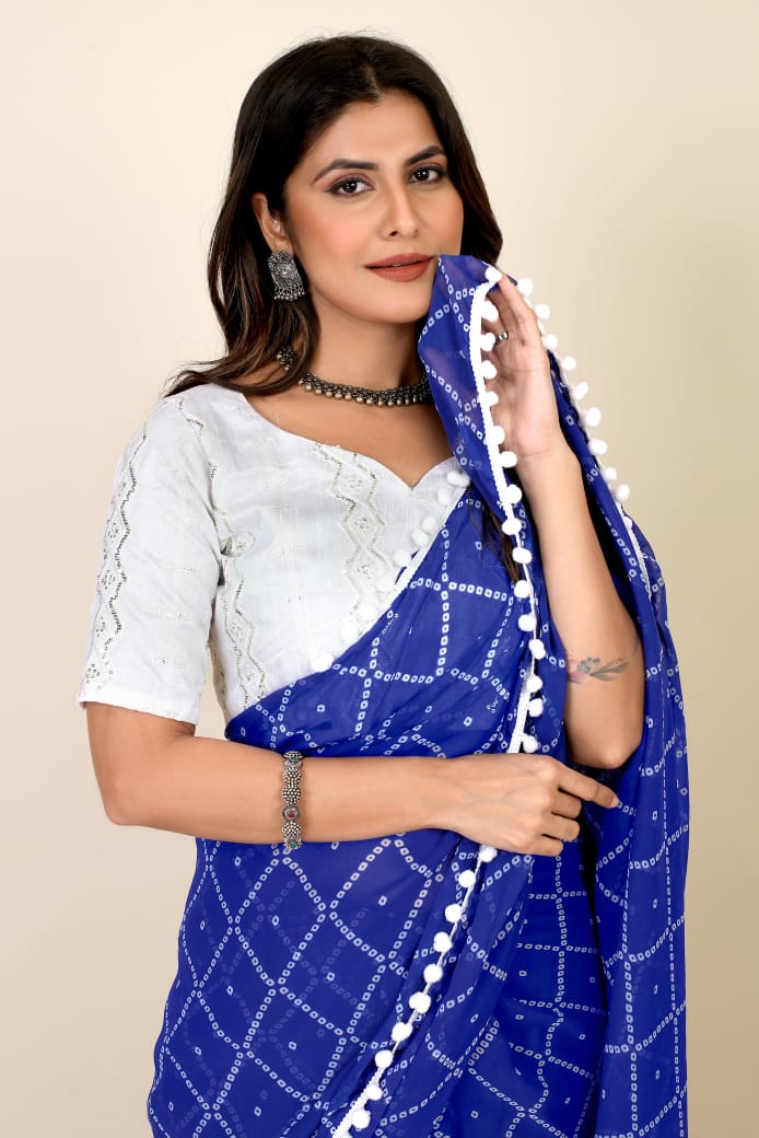 GEORGETTE PRINT  SAREE WITH WHITE PUMPUM LESS BORDER